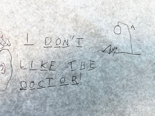 Paper saying "I don't like the doctor".