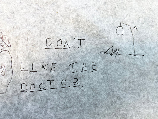 Paper saying "I don't like the doctor".